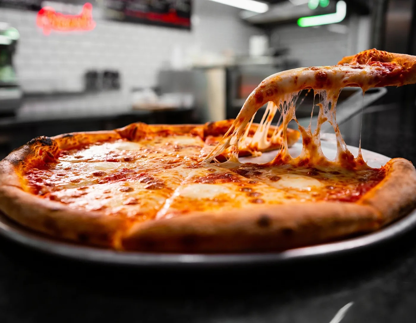 Fresh pizza with cheese pull